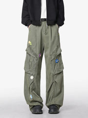 Men's green wide-leg pants with an oversized fit and pockets.