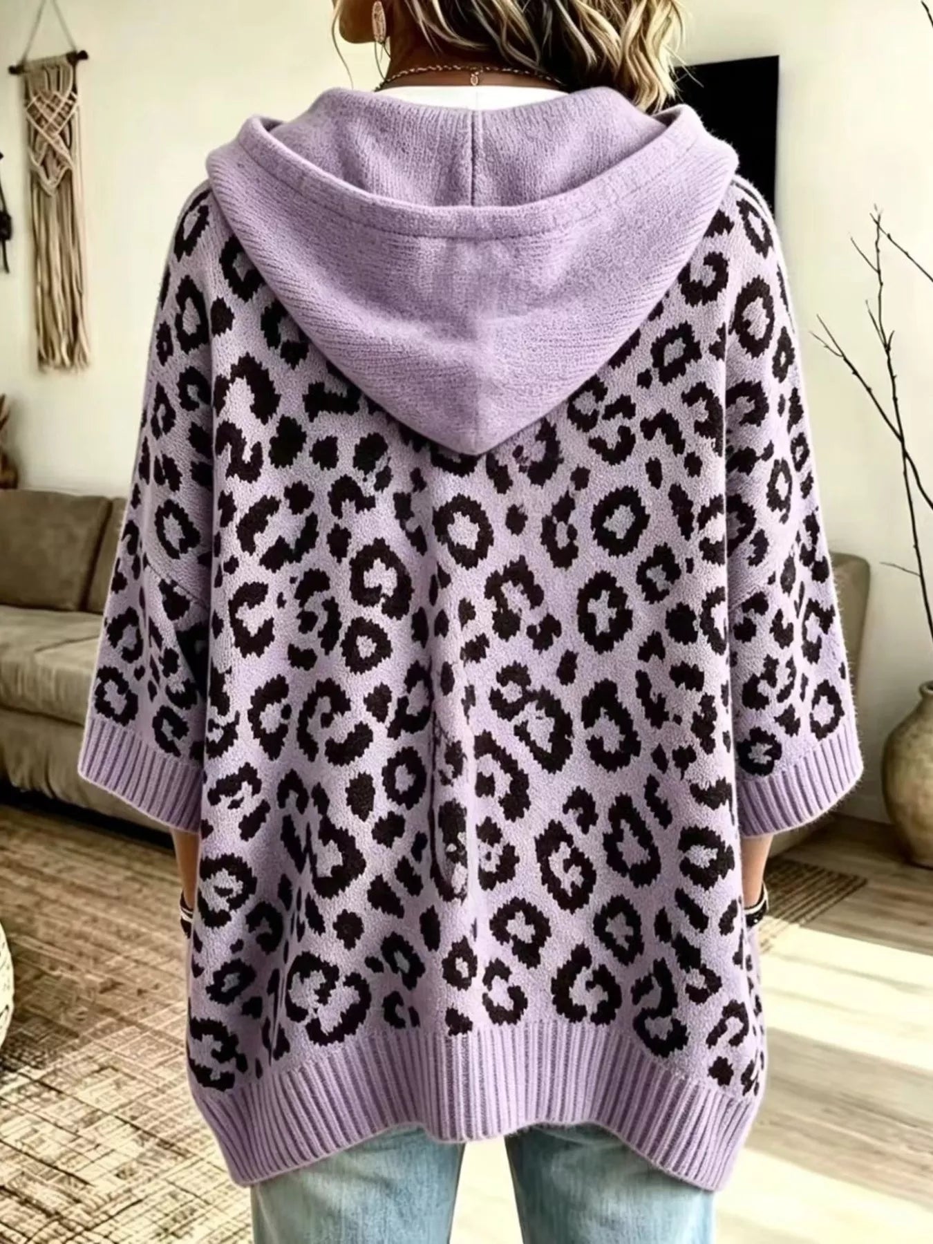 Back view of lavender leopard print oversized hooded knit sweater with solid lavender hood