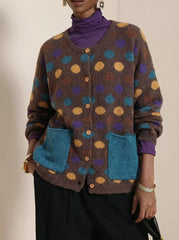 Coffee brown polka dot cardigan with buttons and teal pockets on model
