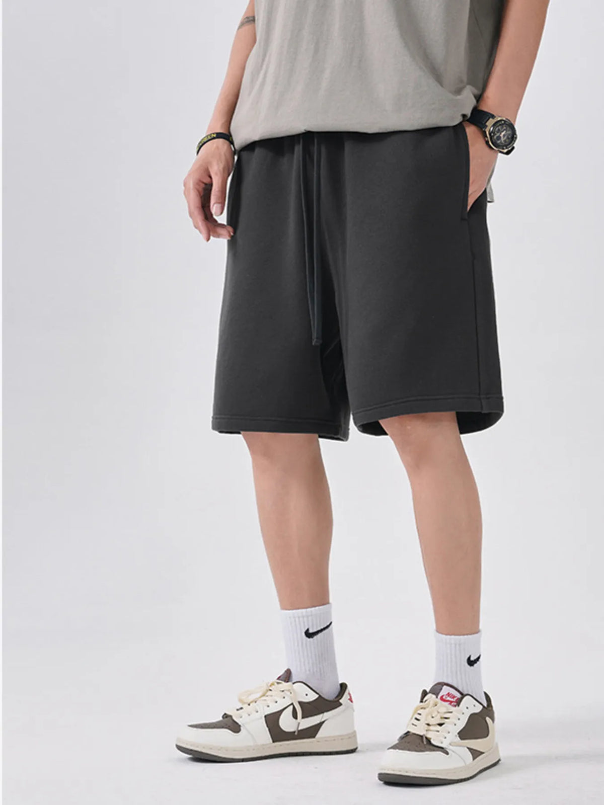 Men's dark gray casual shorts with a drawstring waist.