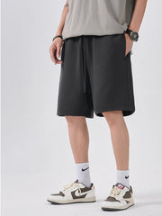 Men's dark gray casual shorts with a drawstring waist.