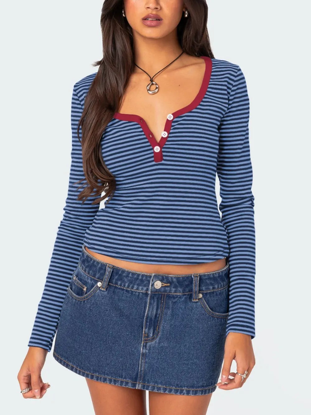 Blue and navy striped long sleeve t shirt with deep red trim and white buttons worn on model front view