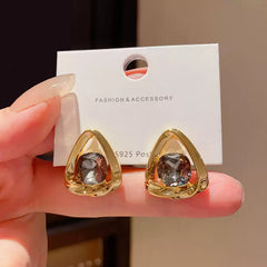 Chic Gold Tone Drop Earrings with Geometric Blue Smooth Accent