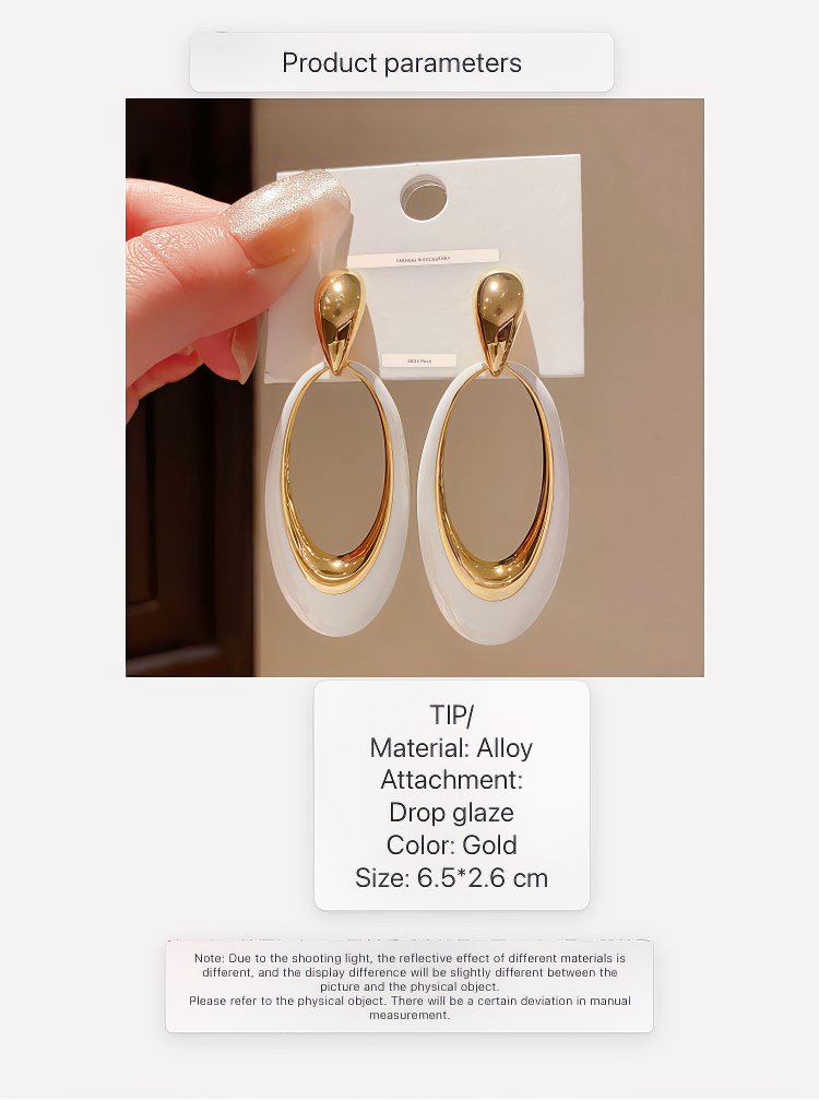 Contemporary Gold Tone Drop Earrings with Elongated White Smooth Oval Inlay