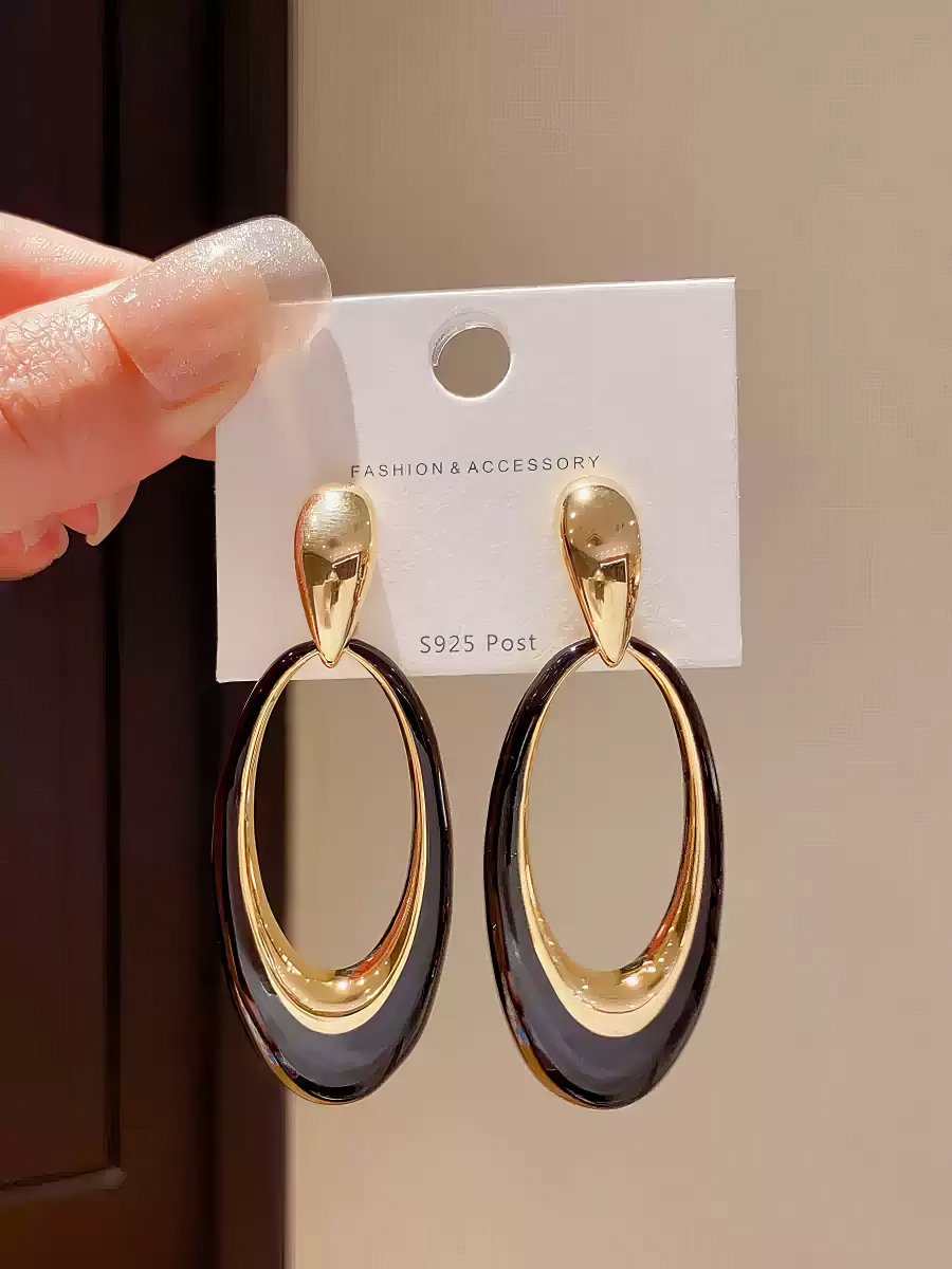 Contemporary Gold Tone Drop Earrings with Elongated White Smooth Oval Inlay