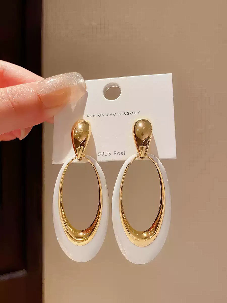 Contemporary Gold Tone Drop Earrings with Elongated White Smooth Oval Inlay