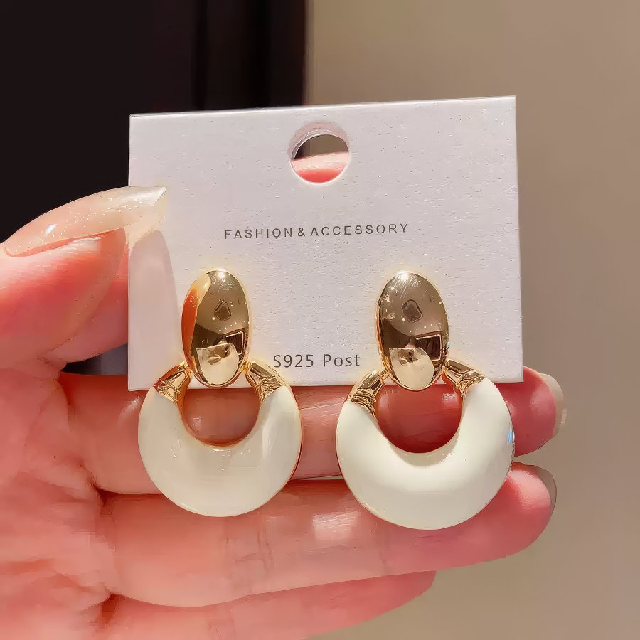 Exquisite Geometric Earrings with Smooth Toned Finish