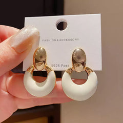 Exquisite Geometric Earrings with Smooth Toned Finish