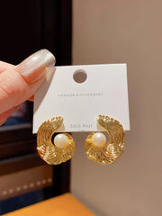 Refined Gold Tone Abstract Swirl Stud Earrings with Creamy White Faux Pearl