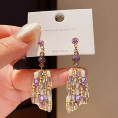 Refined Gold Tone Drop Earrings with Purple and Champagne Crystals
