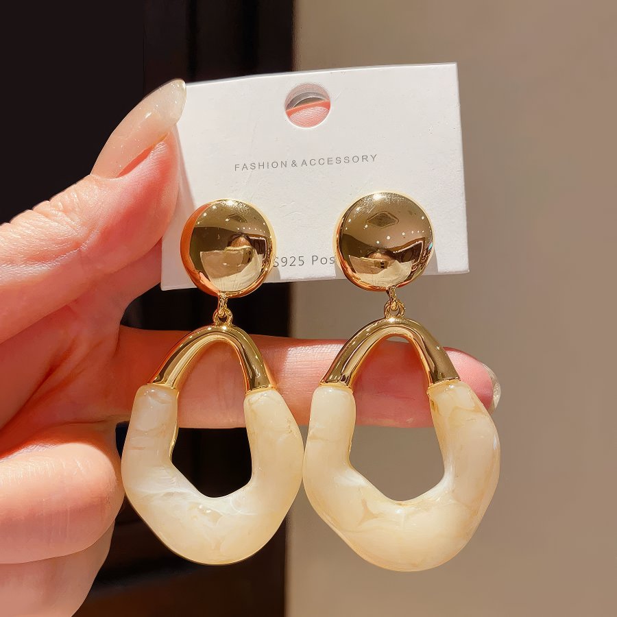 Stylish Gold Tone Drop Earrings with Round Top and Irregular Creamy White Geometric Inset