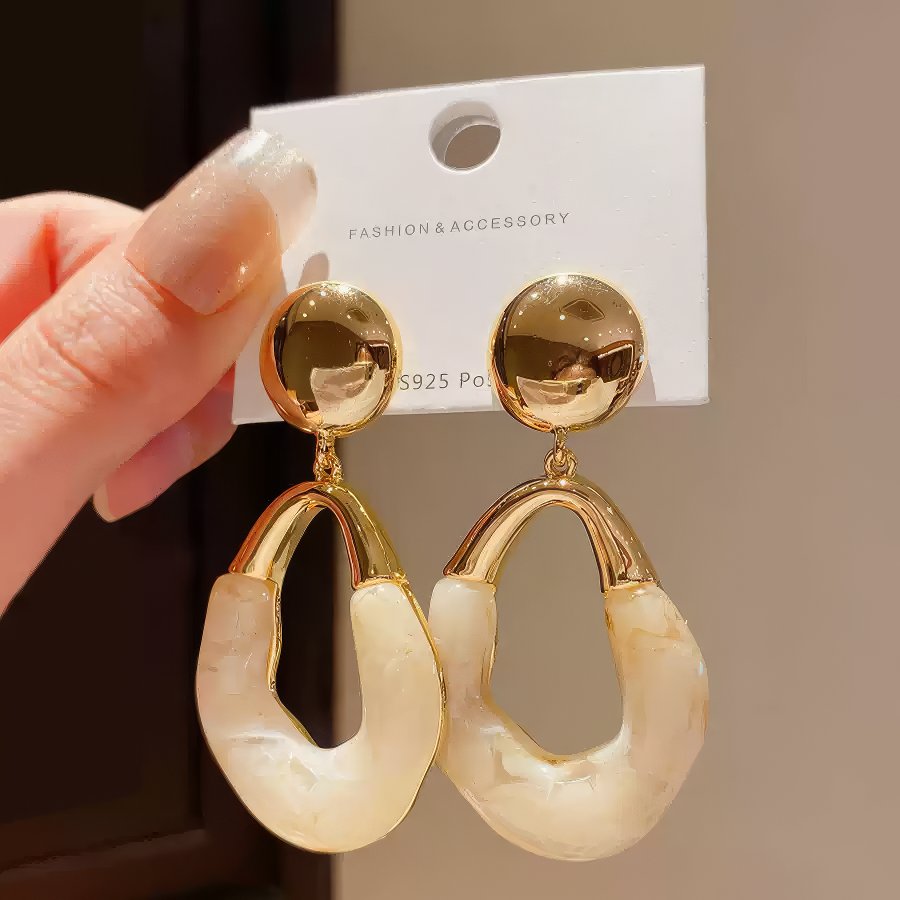 Stylish Gold Tone Drop Earrings with Round Top and Irregular Creamy White Geometric Inset