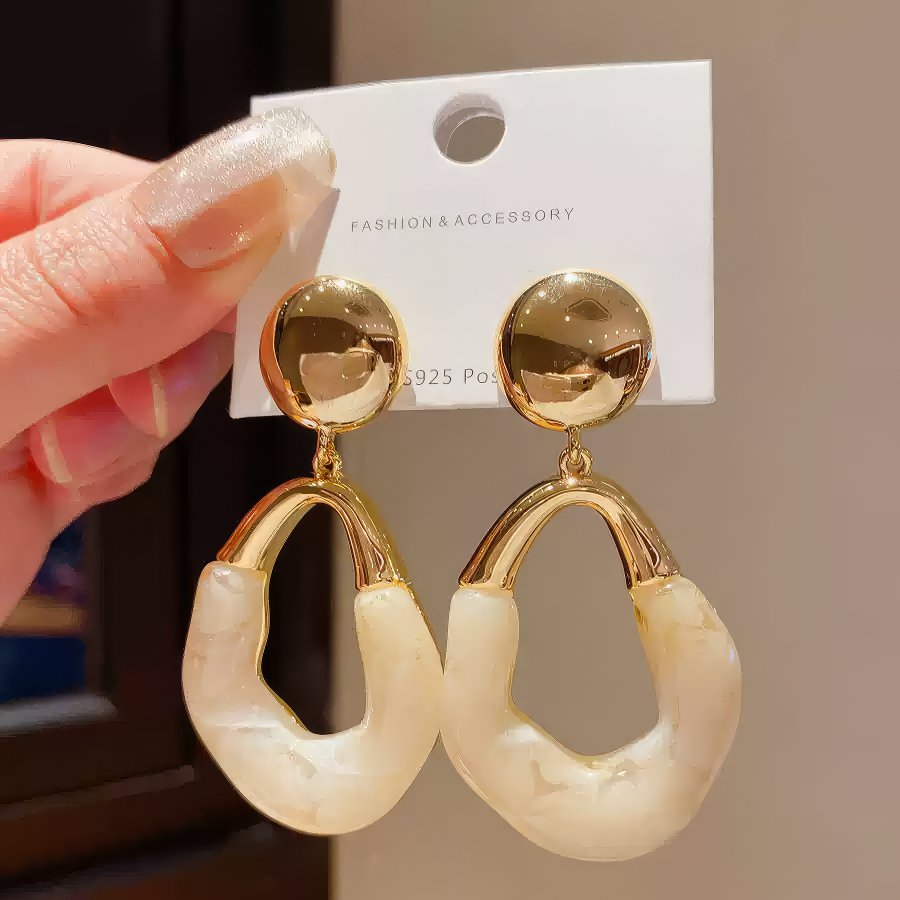 Stylish Gold Tone Drop Earrings with Round Top and Irregular Creamy White Geometric Inset