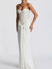White strapless sequin corset maxi dress on model, three quarter front view in studio