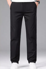 Men's black slim-fit stretch dress pants with pockets.