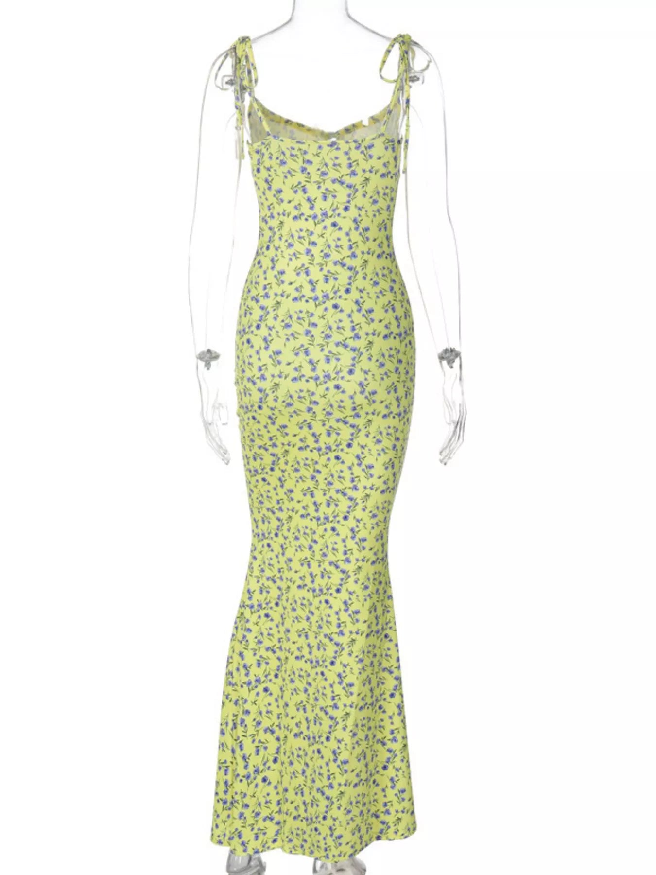 Back view of clear mannequin wearing yellow floral print bodycon maxi dress with tie straps