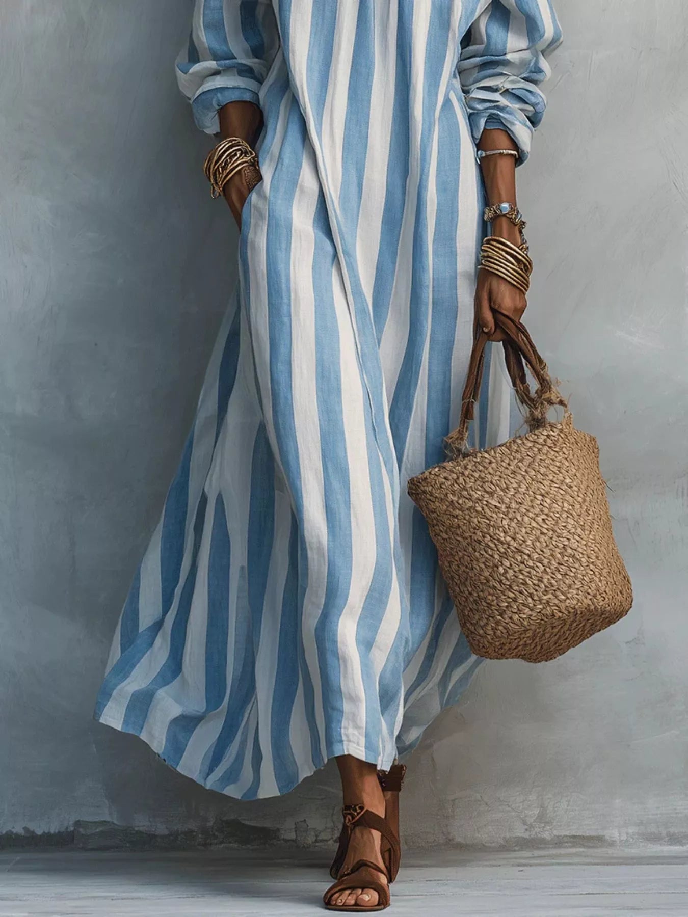 Lower view of sky blue and white striped off shoulder dress showing flowing skirt