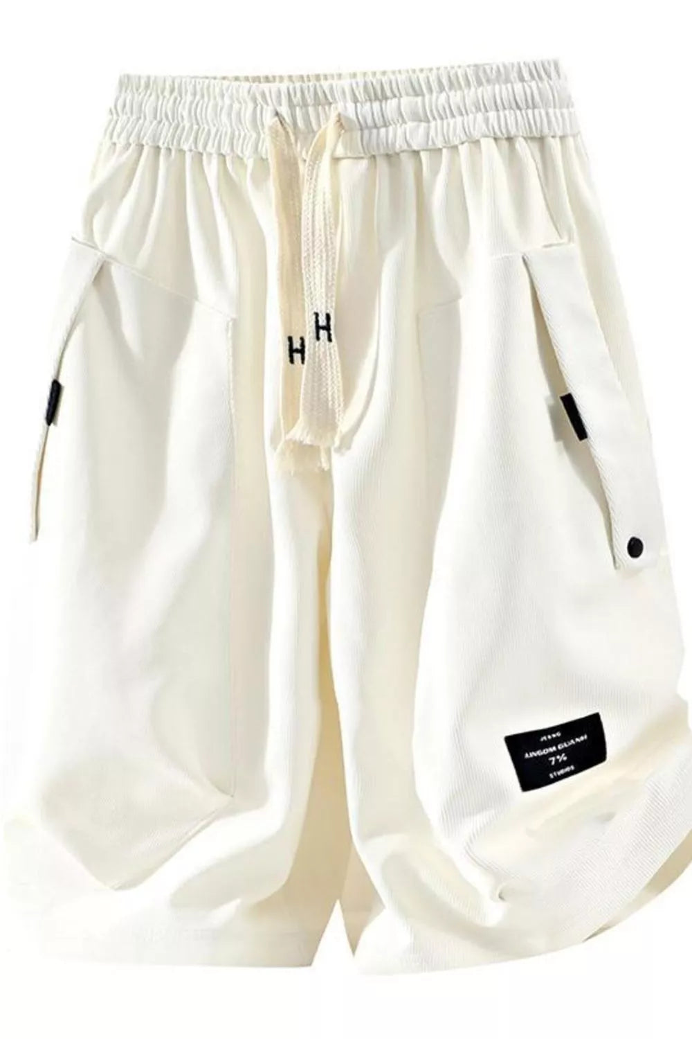 Men's ivory lightweight shorts with a drawstring waist and pockets.