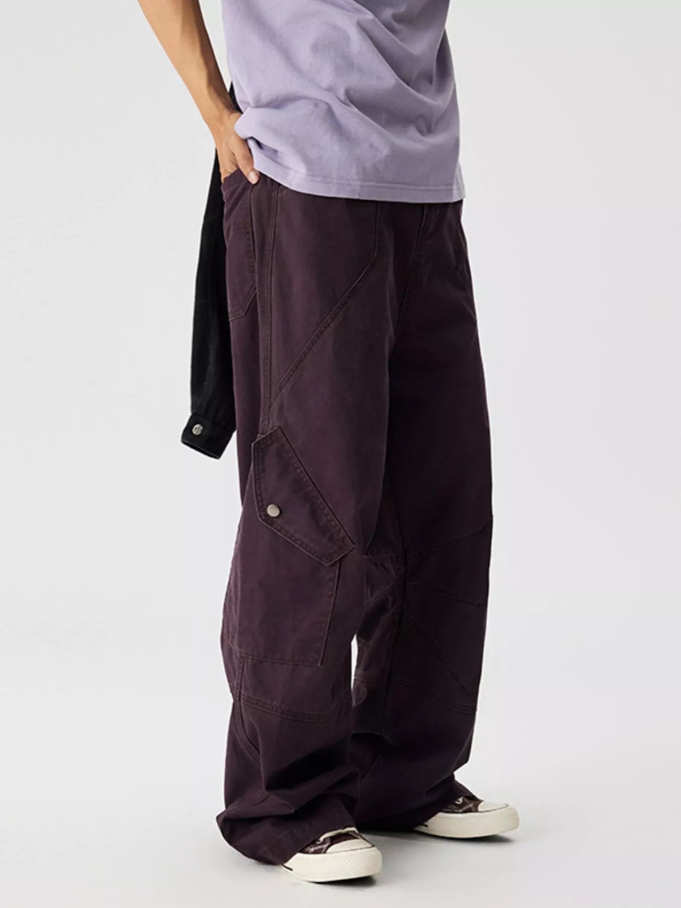 Men's plum purple wide leg cargo pants with pockets.