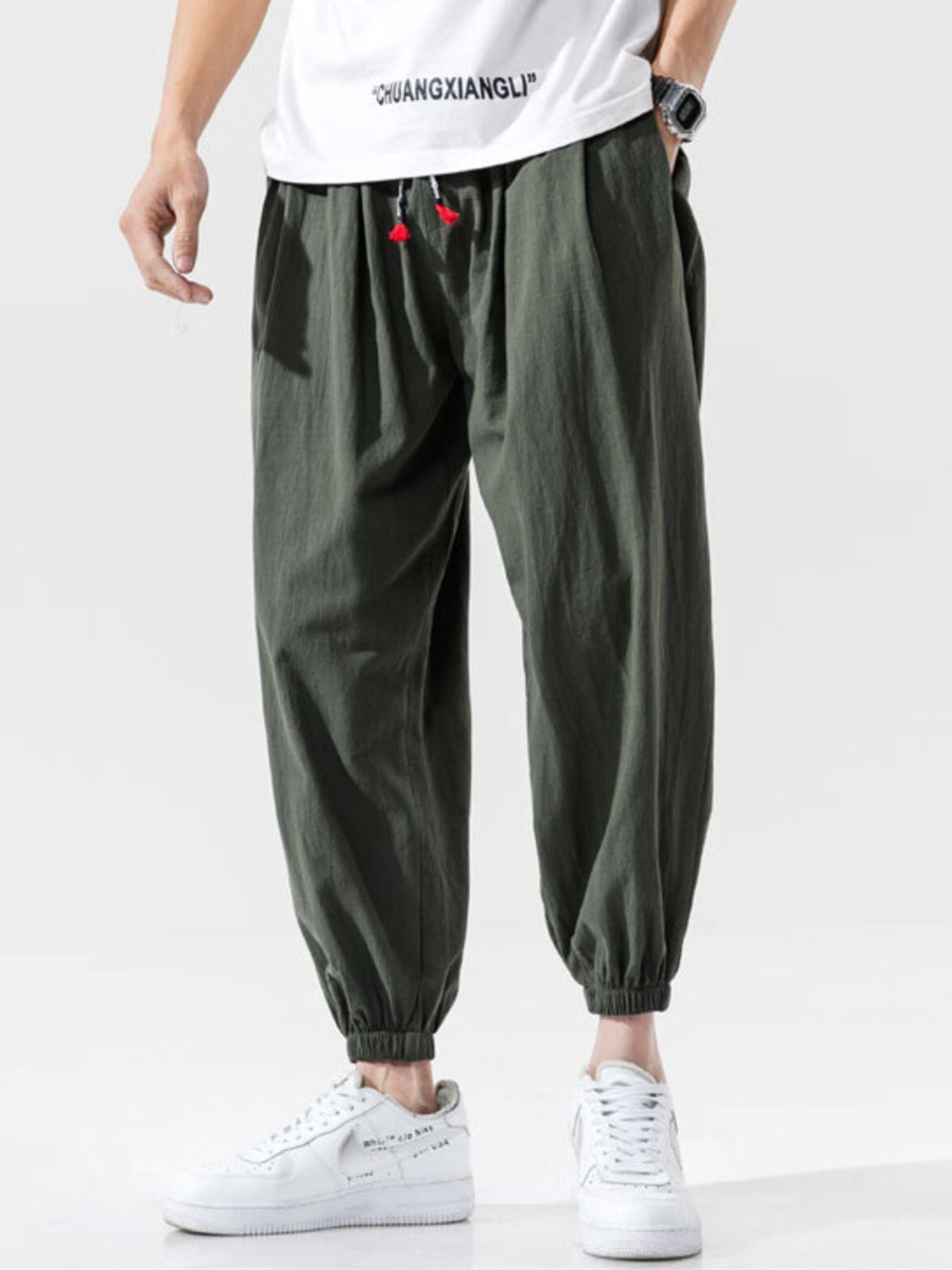 Men's loose fit joggers with a drawstring waist and pockets.
