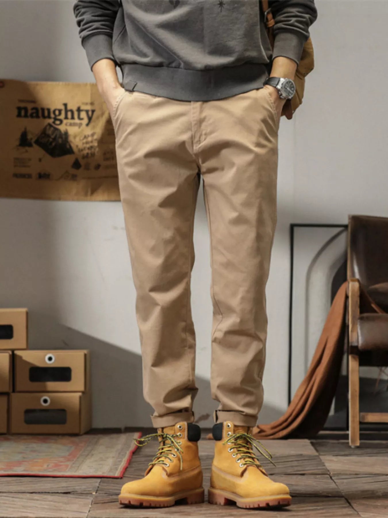 Men's slim fit casual pants with banded ankles and pockets.