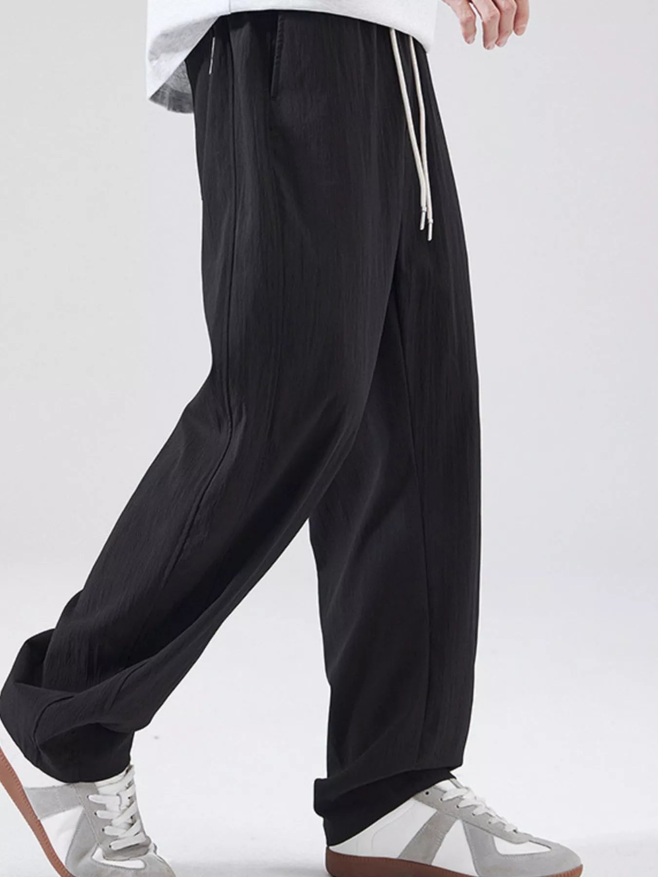 Men's casual wide leg pants with a drawstring waist.