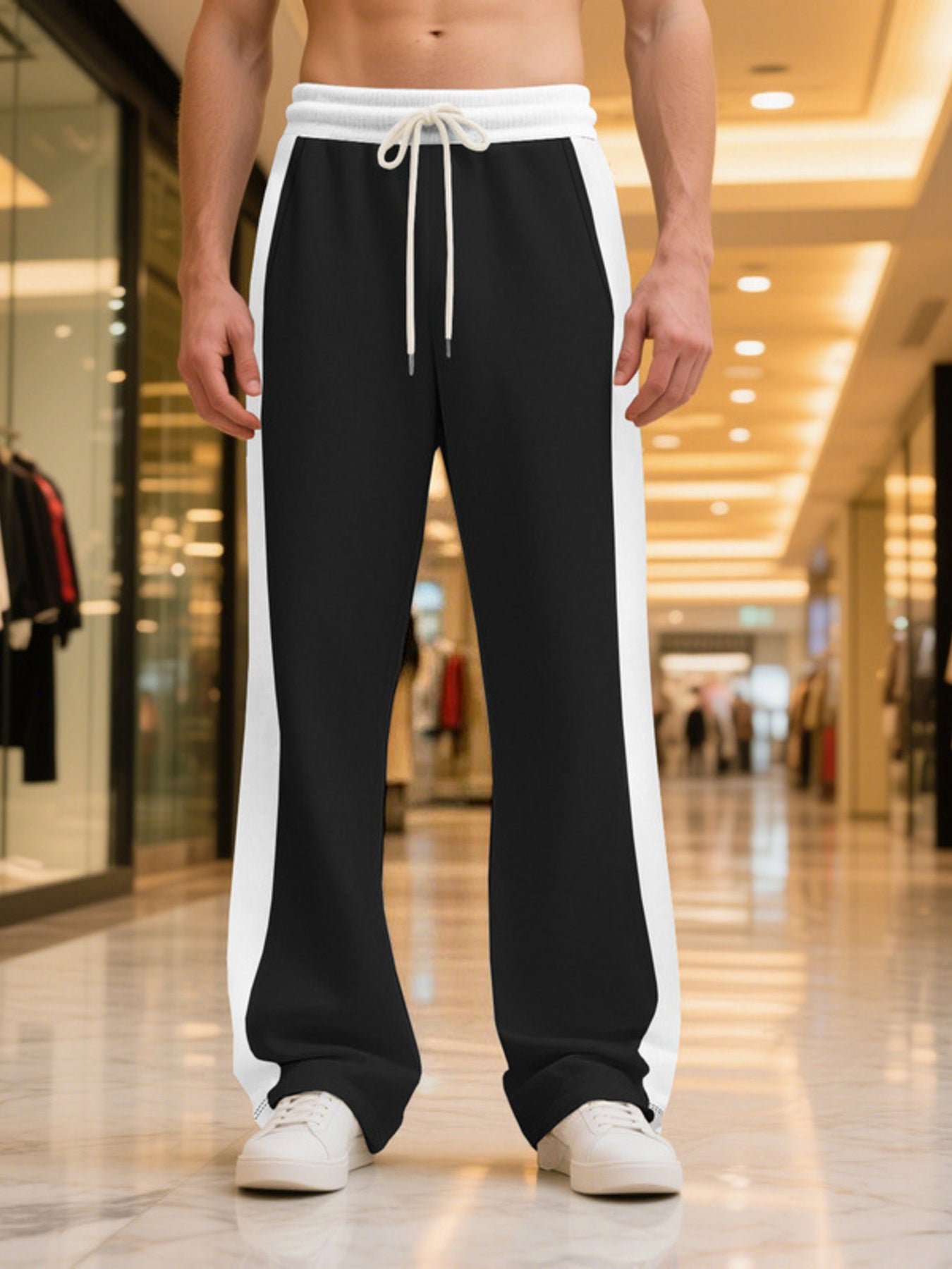 Men's contrast stripe sweatpants with a drawstring waist and pockets.