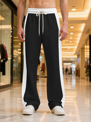 Men's contrast stripe sweatpants with a drawstring waist and pockets.