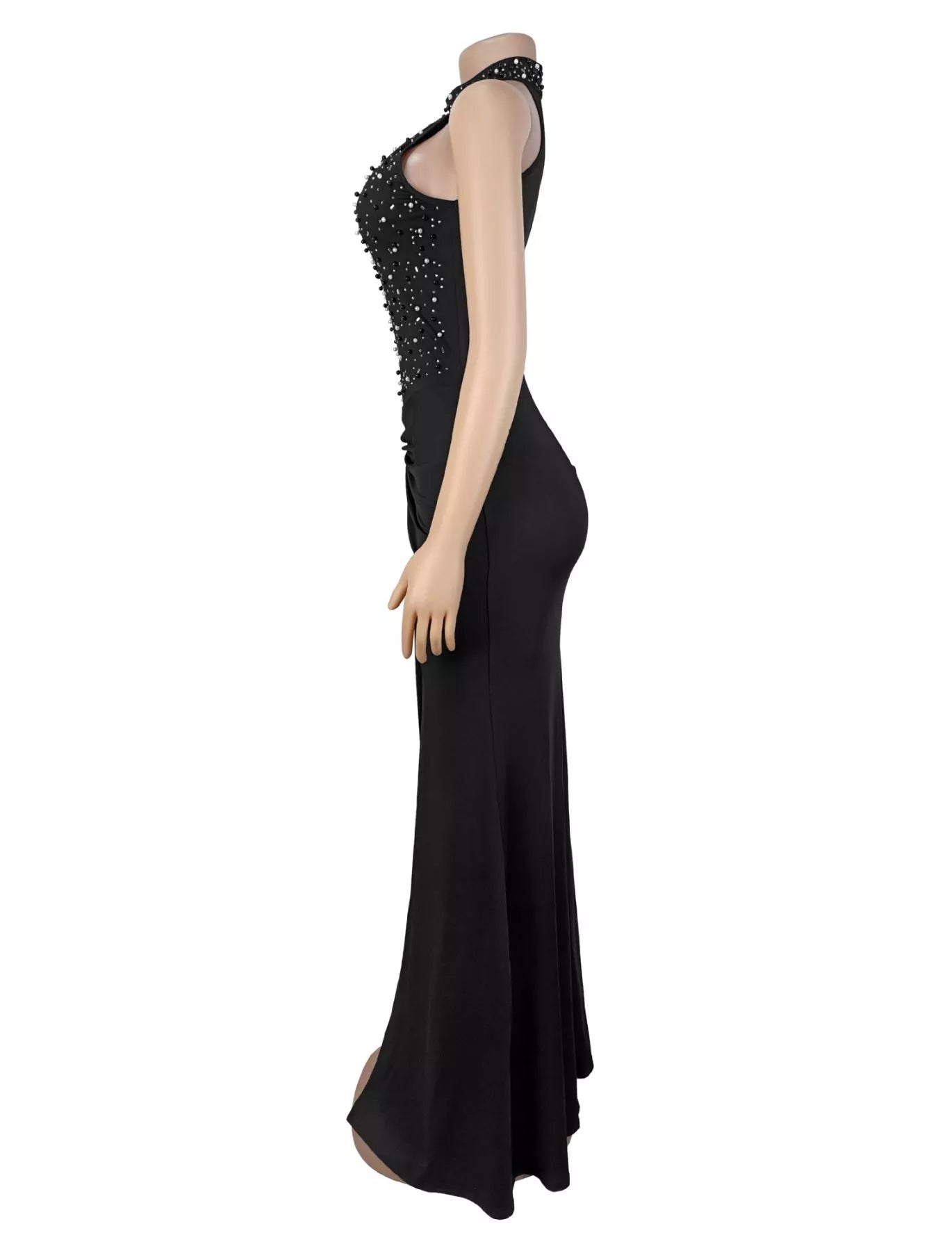 Side view of black sleeveless maxi dress on a mannequin showing rhinestone halter bodice
