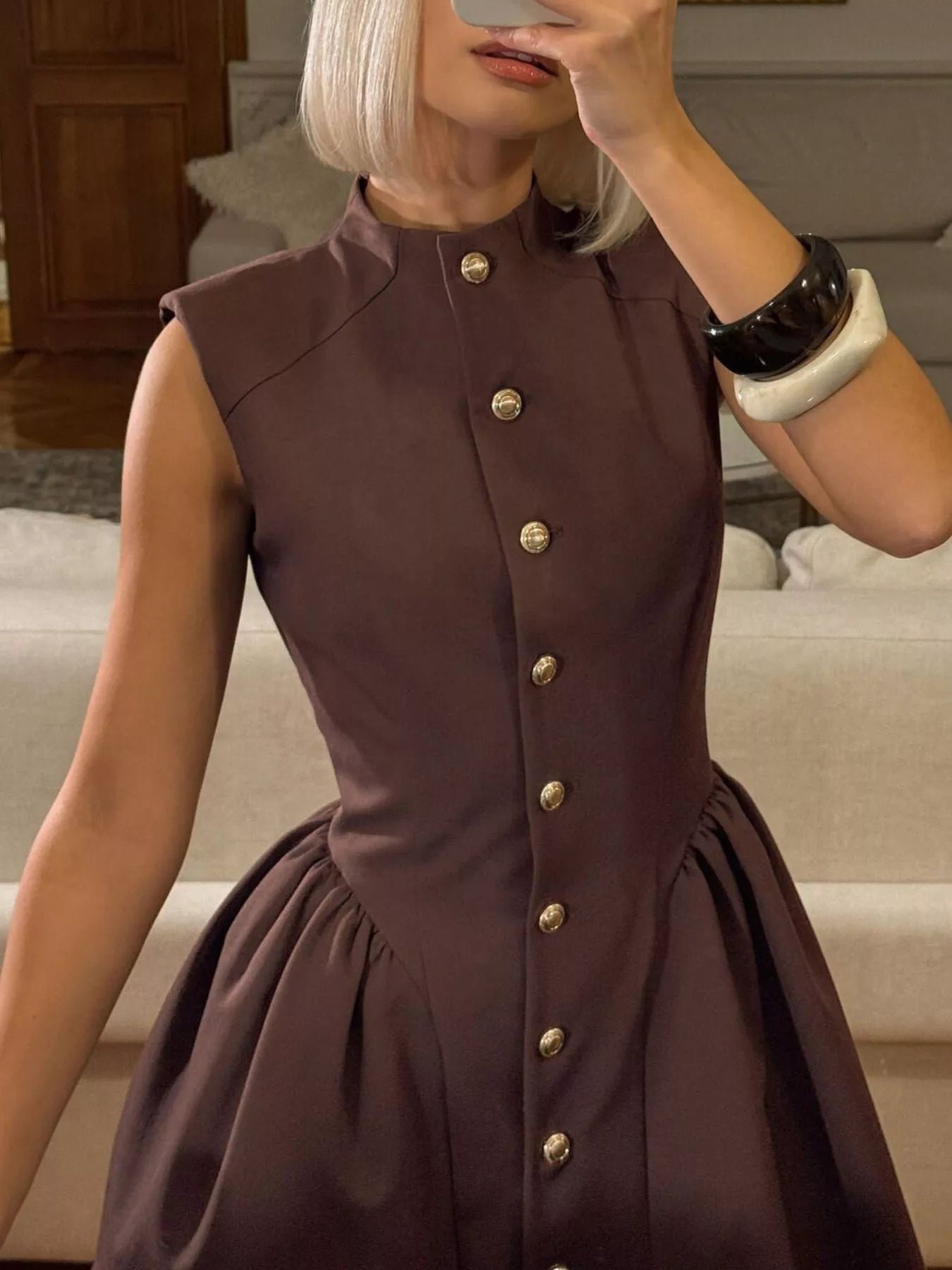 Brown sleeveless button down mini dress, close mirror view of bodice and gold buttons