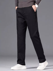 Men's black slim-fit pants made from cotton with pockets.