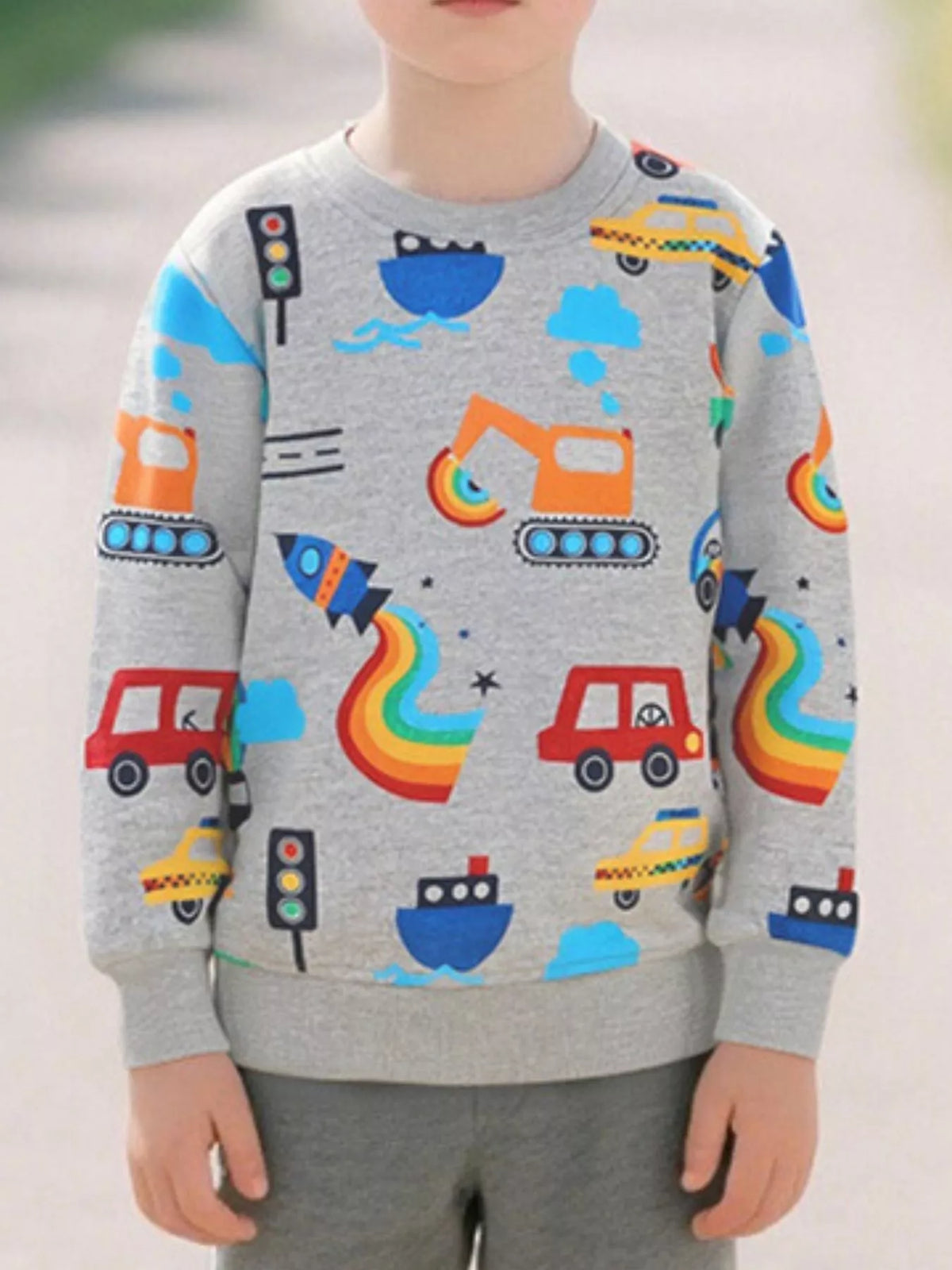 Light gray children's long sleeve sweatshirt with colorful transportation cars boats rockets and excavators front view