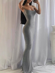 Mirror selfie showing the side profile of a dark gray spaghetti strap bodycon maxi dress