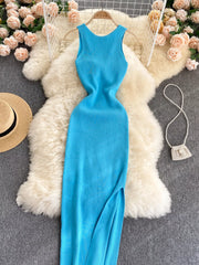 Bright blue sleeveless knit bodycon midi dress, front view with side slit laid flat