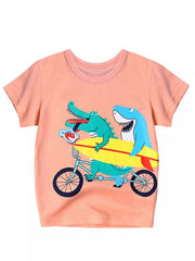 Pink children's short sleeve T-shirt laid flat with a crocodile and shark riding a tandem bicycle