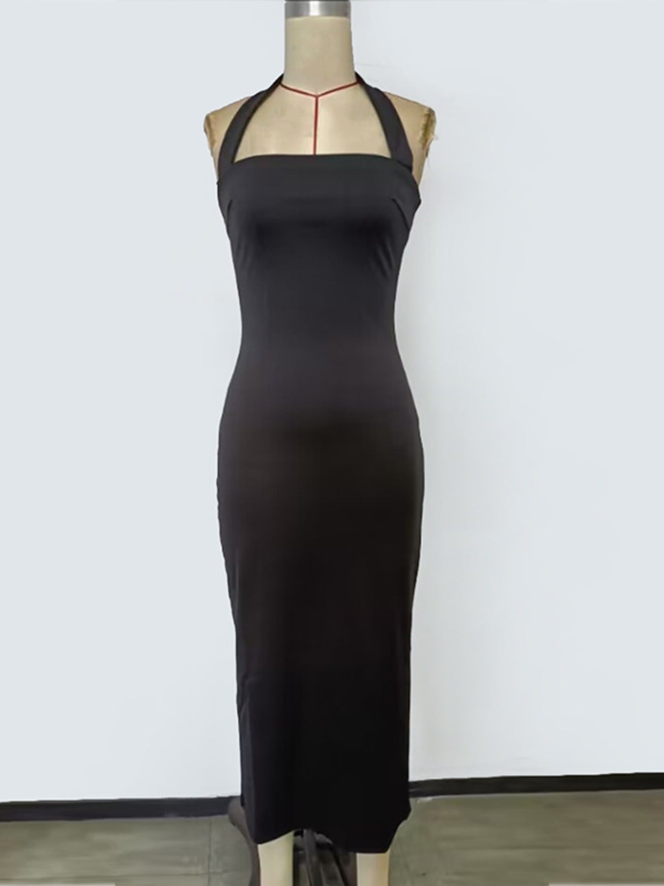 Black halter neck bodycon midi dress displayed on mannequin front view