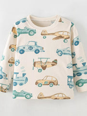 Cream children's long sleeve T-shirt laid flat with a blue and tan cars, planes and trains print