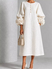 White round neck midi dress with balloon sleeves, floral cuffs and small floral buttons, front view