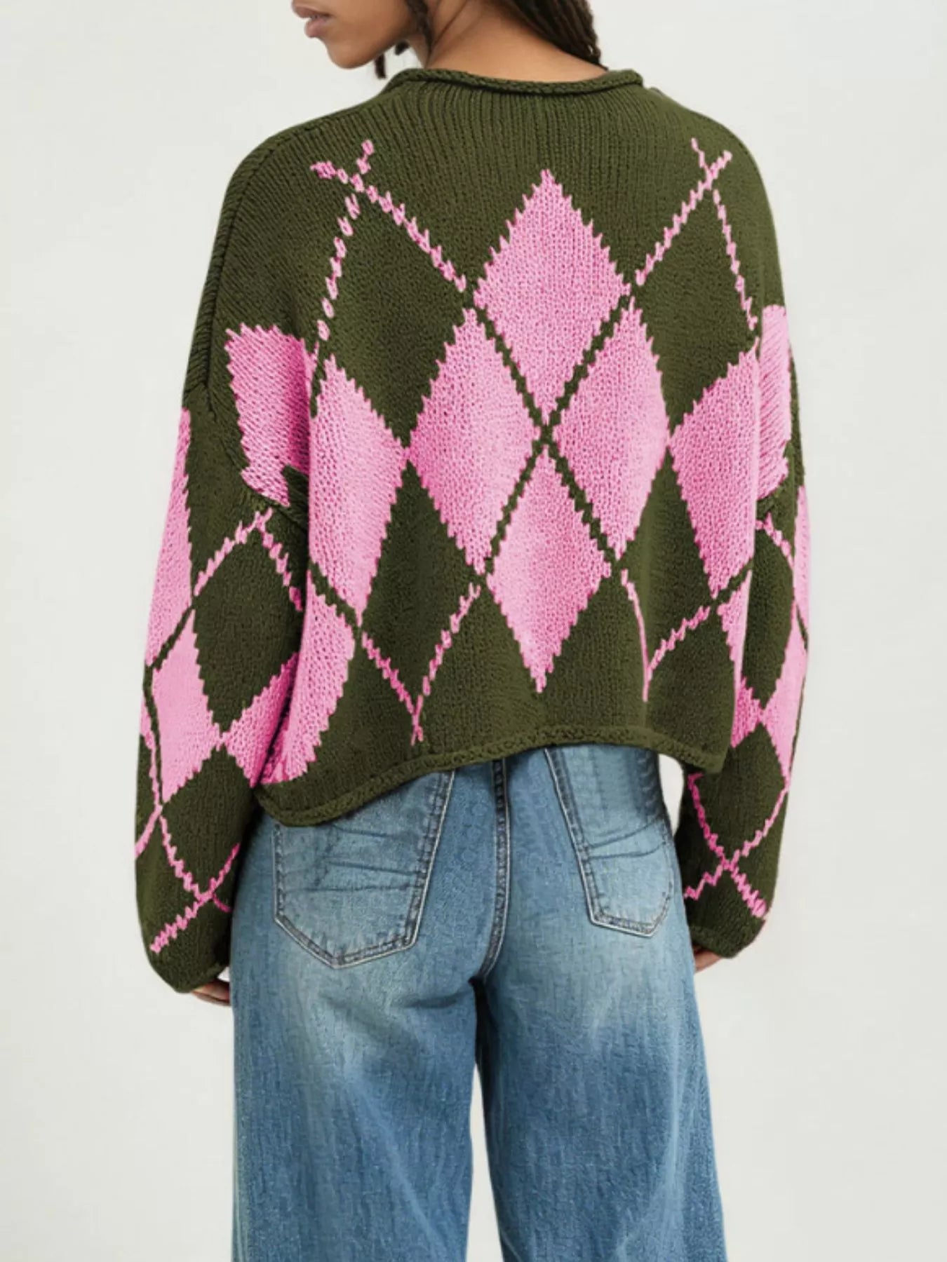 On-model back view of the olive green and pink argyle knit sweater with dropped shoulders