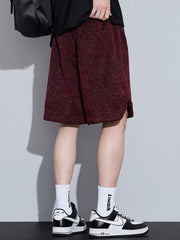 Men's loose fit shorts with a drawstring waist and pockets.
