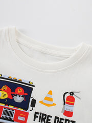 Angled close-up of white children's t-shirt collar with fire truck cone and extinguisher