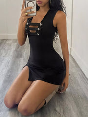 Black sleeveless bodycon mini dress with buttoned chest cut outs, kneeling angled front view