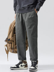 Men's loose fit pants with a drawstring waist.