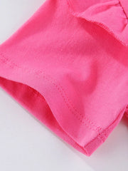 Close-up of ruffle sleeve edge and hem stitching on fuchsia pink children's tee