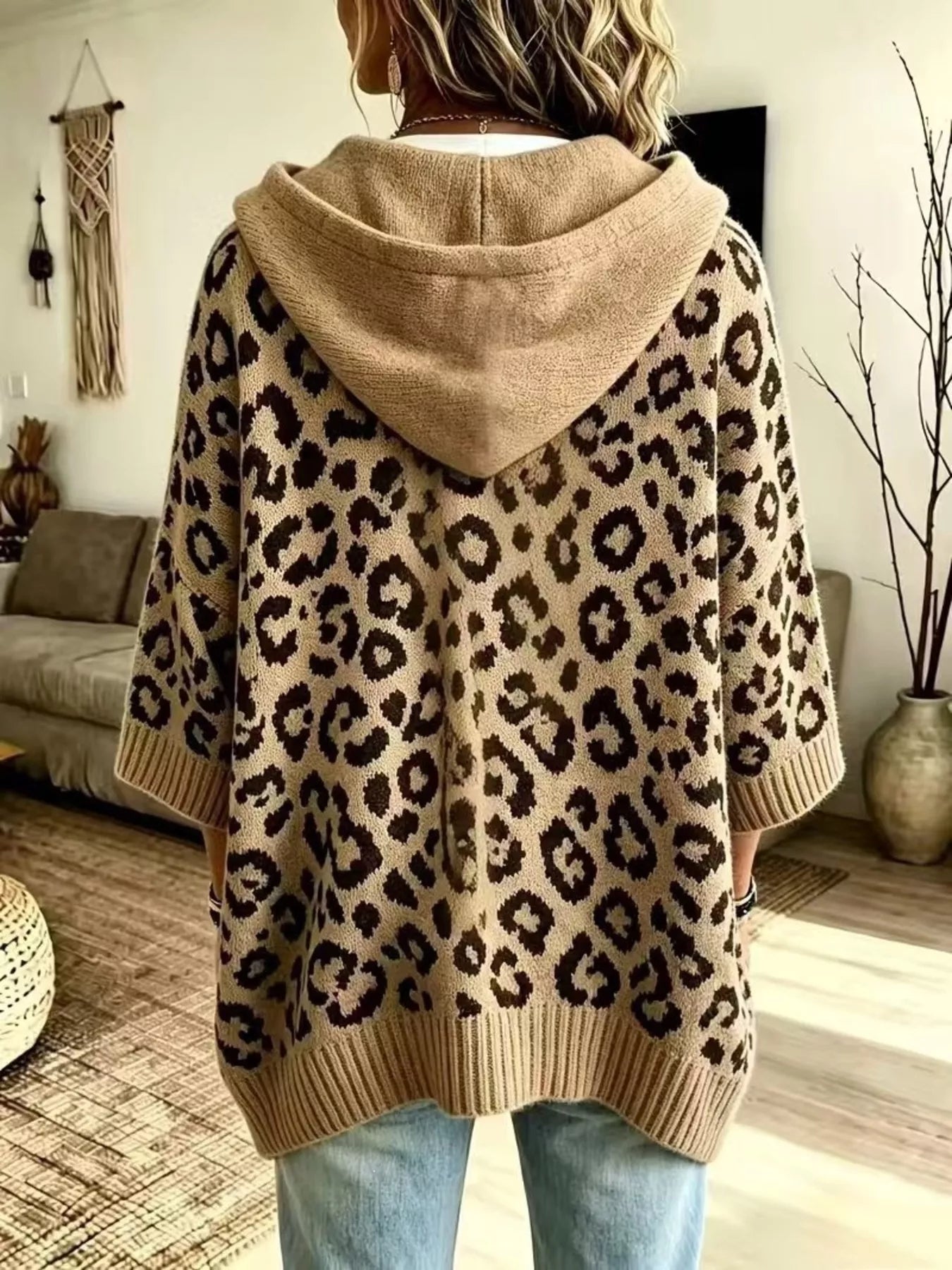 Back view of beige leopard print oversized hooded knit sweater with solid beige hood