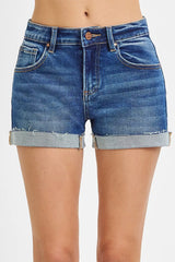 Women's low-rise cuffed shorts with raw hem detailing and a relaxed fit.
