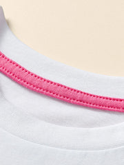 Close view of the white children's tee neckline with a bright pink inner trim and neat stitching