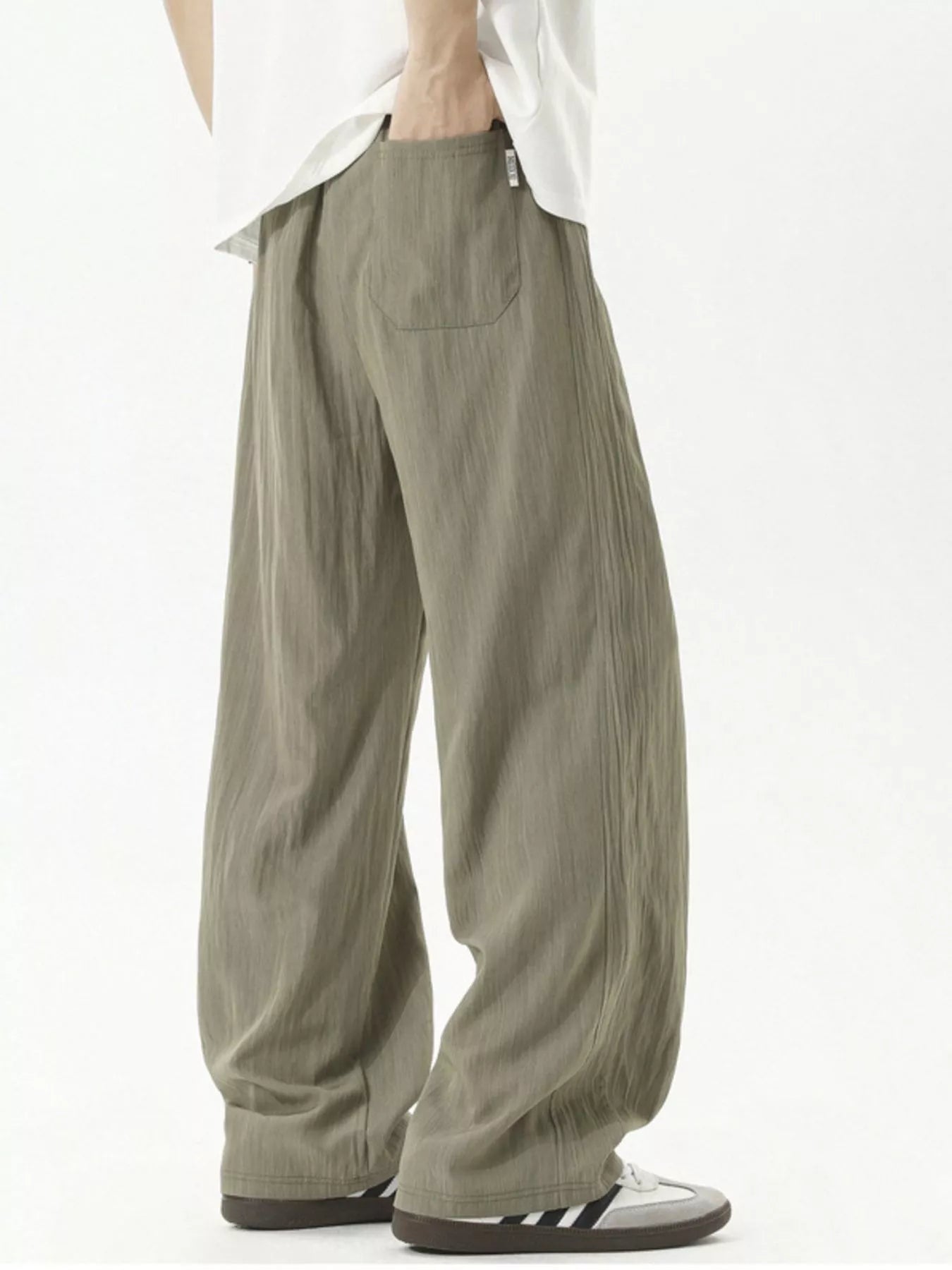 Men's lightweight loose fit casual pants with a drawstring waist.