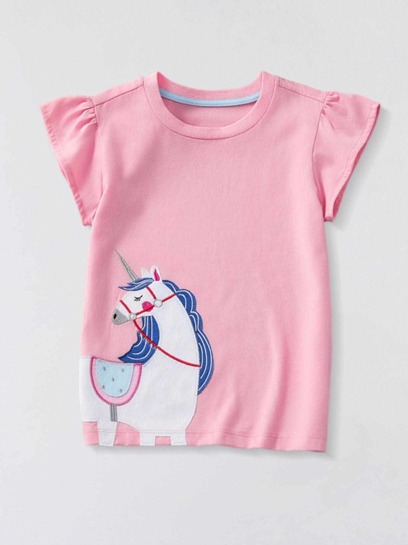 Flat front view of a blush pink children's tee with ruffle sleeves and white unicorn applique