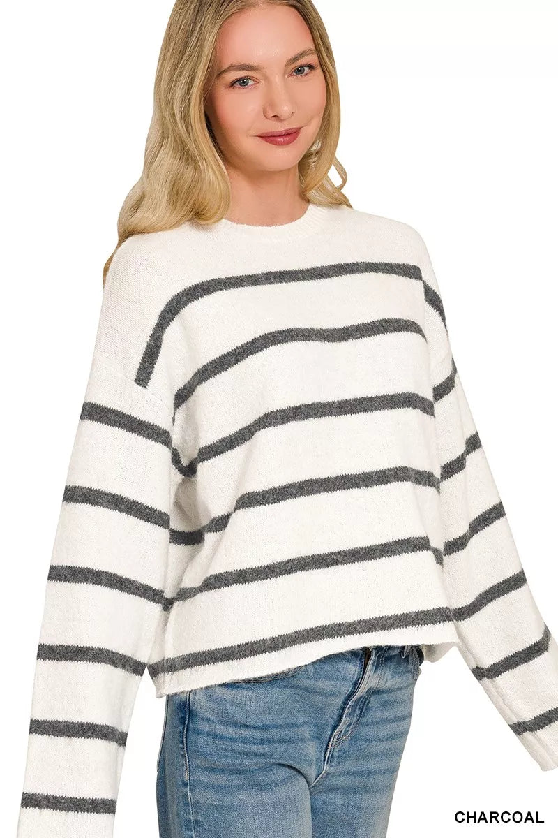 White wool blend striped sweater with charcoal stripes worn with light jeans